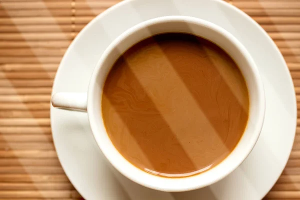 Una taza de café en un platillo — Foto de Stock