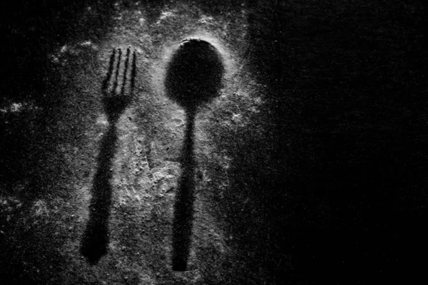 Imprint of a spoon and fork in the sand — Stock Photo, Image