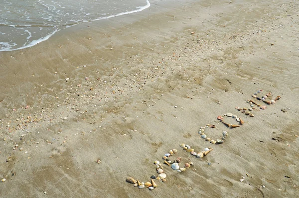 Redação bem-vinda na praia — Fotografia de Stock