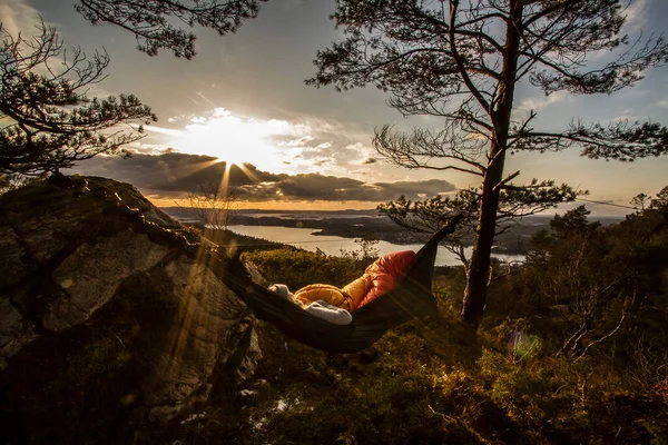 Relaxing in a hammock at sunset
