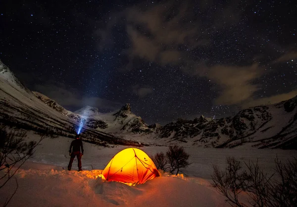 A man looking up at the stars