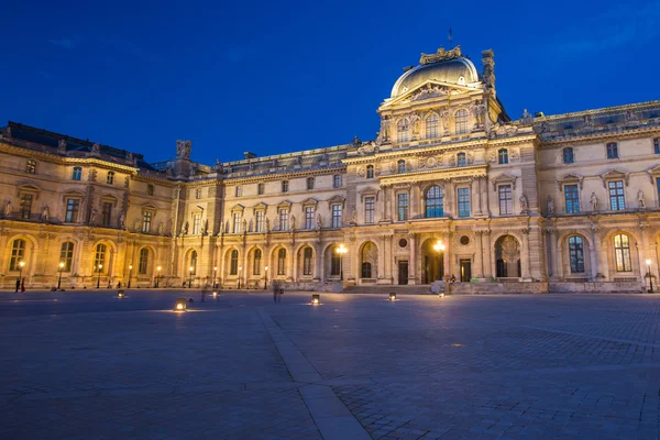 Louvre Museum at night in Paris, France