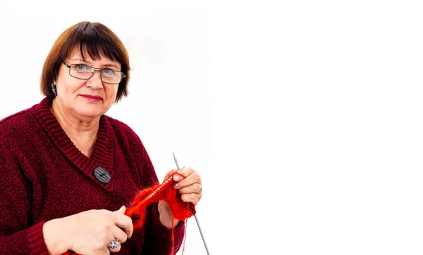Caucasian Grandmother Knits Smiles White Background Copy Space — Stock Photo, Image