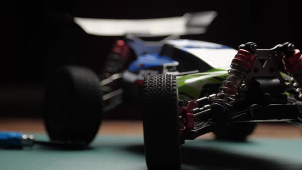 Close-up radio control model buggy car on cutting mat, front view. — Stok Video