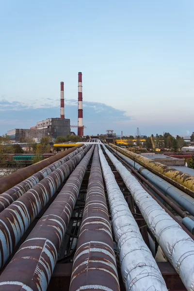 Pipe leading to the thermal power plant in the background perspective — Stock Photo, Image