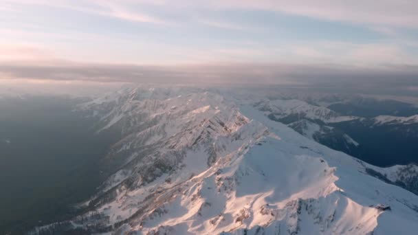 Snowy slopes of Roza Khutor and Alpia resorts at Aibga ridge — Stock Video