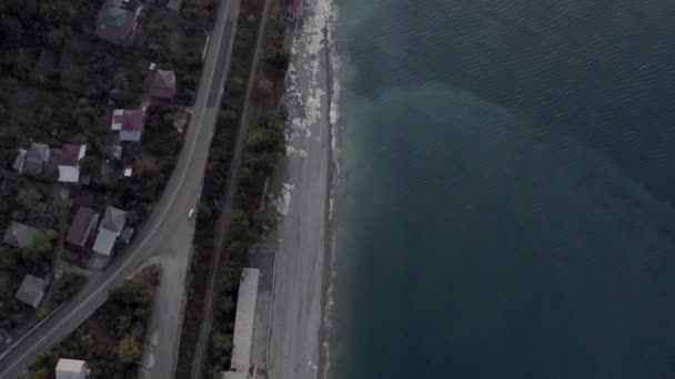 View from above nature landscape with sea coast and asphalt highway at early morning sunrise — Wideo stockowe