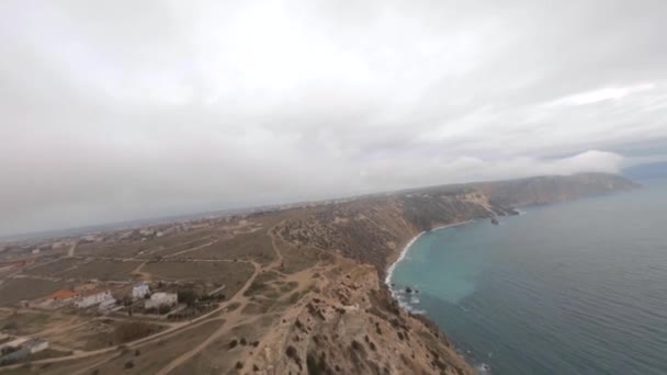 Aerial takeoff shot flying over natural huge mountain clouds fog — Stock Video