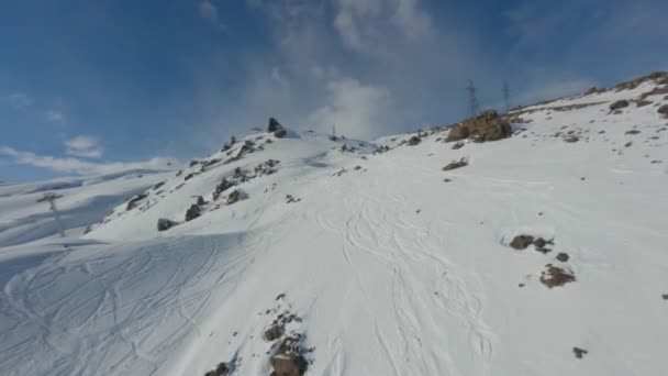 Picturesque mountain landscape of ski resort with high mountain downhill snowy peaks and cableway — Stock Video