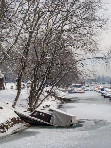 Old boat on the frozen lake Royalty Free Stock Photos