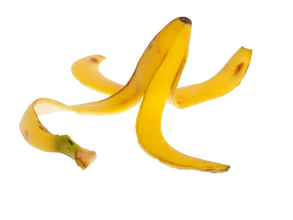 Rutschige Bananenschale auf weißem Hintergrund — Stockfoto