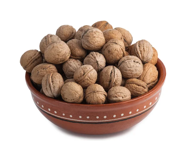 Ceramic bowl full of walnuts — Stock Photo, Image