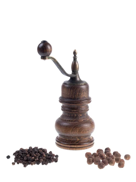 Mill for pepper with black peppercorns and allspice corns isolat — Stock Photo, Image