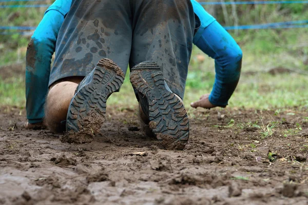 Mud race runners — Stock Photo, Image