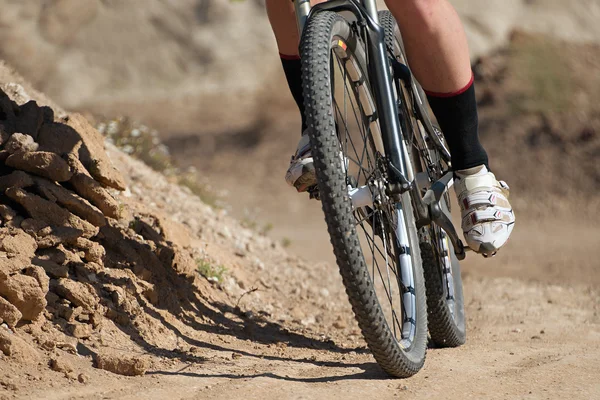 Downhill mountain bike on dirt road — Stock Photo, Image