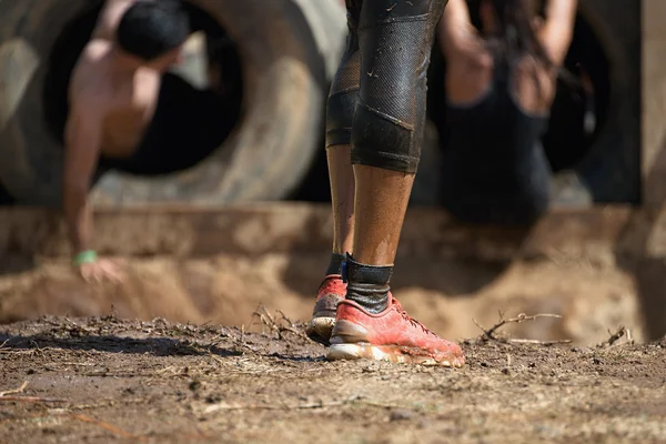 Mud race runners — Stock Photo, Image