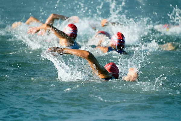 Group people in wetsuit swimming — Stock Photo, Image