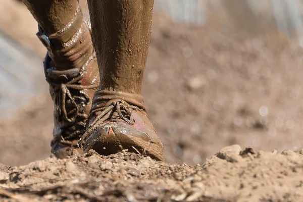 Mud race runners — Stock Photo, Image