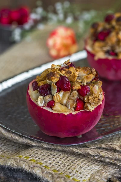 Baked red apples stuffed with granola, cranberries and marzipan — Stock Photo, Image