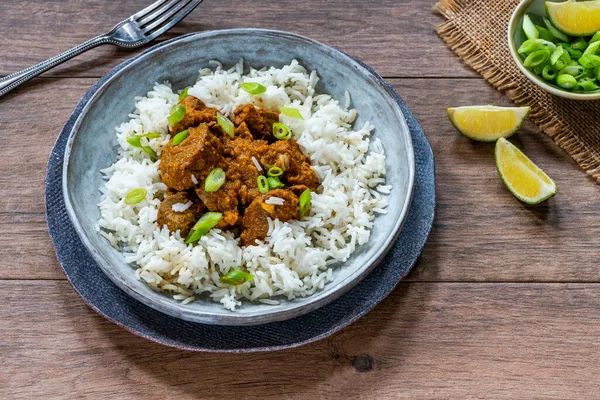 Tamarind duck curry with basmati rice - high angle view