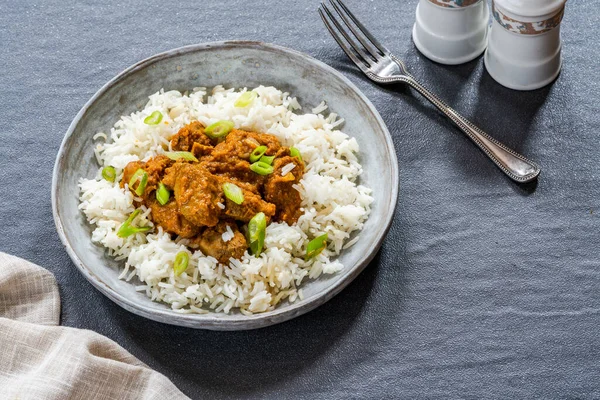 Tamarind duck curry with basmati rice - high angle view