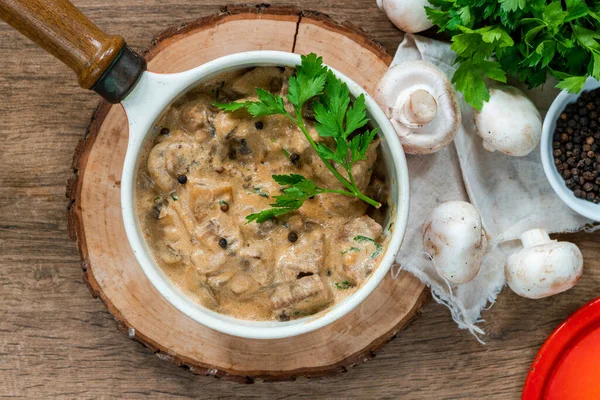 Beef goulash with creamy mushroom and black peppercorn sauce - overhead view