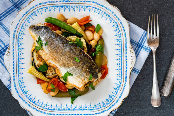 Sea bass with tomato and butter bean ragout - overhead view