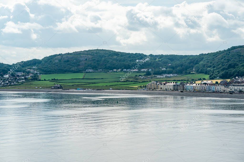 View of Llandudno promenade across Landudno Bay in Wales.