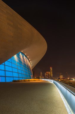 Night view of The Aquatics Centre in Queen Elizabeth Olympic Park - London, UK clipart