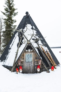 Typical Finnish hut in winter scenery clipart