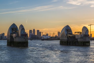 Canary wharf and Thames Barrier at dusk, London UK clipart