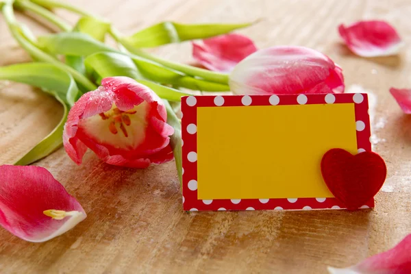 Bouquet of beautiful tulips with a card. — Stock Photo, Image