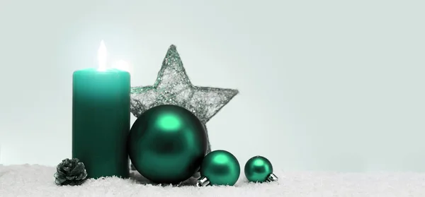 Christmas decoration and green advent candle isolated on blur gray background. — Stock Photo, Image