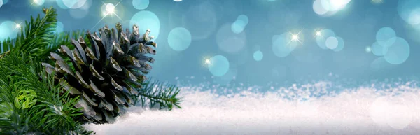 Fir cone on white snow isolated on blue lights background. — Stock Photo, Image