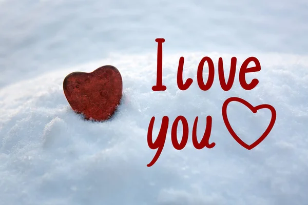 Red stone heart in white snow.Valentines day card. — Stok Foto