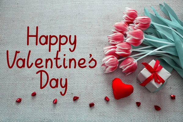 Valentines day background with tulips and red heart on cloth Background. — Stok Foto