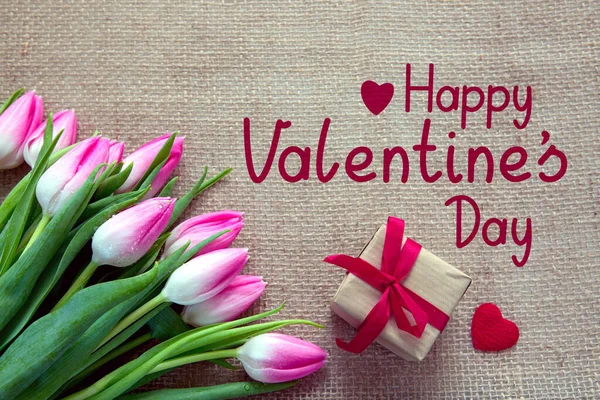 Valentines day background with pink tulips and present — Stok Foto