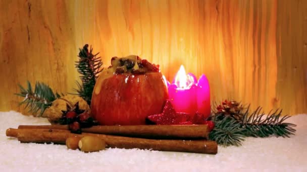 Baked apple with Christmas decoration and flowing honey. — Stock Video