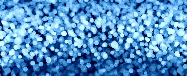 Abstract blue bokeh achtergrond van Kerstmis licht. — Stockfoto