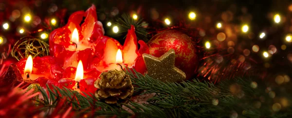 Four red candles with christmas ball and decoration. — Stock Photo, Image