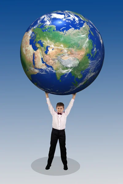 Boy holding in his hands over his head a large globe — Stock Photo, Image