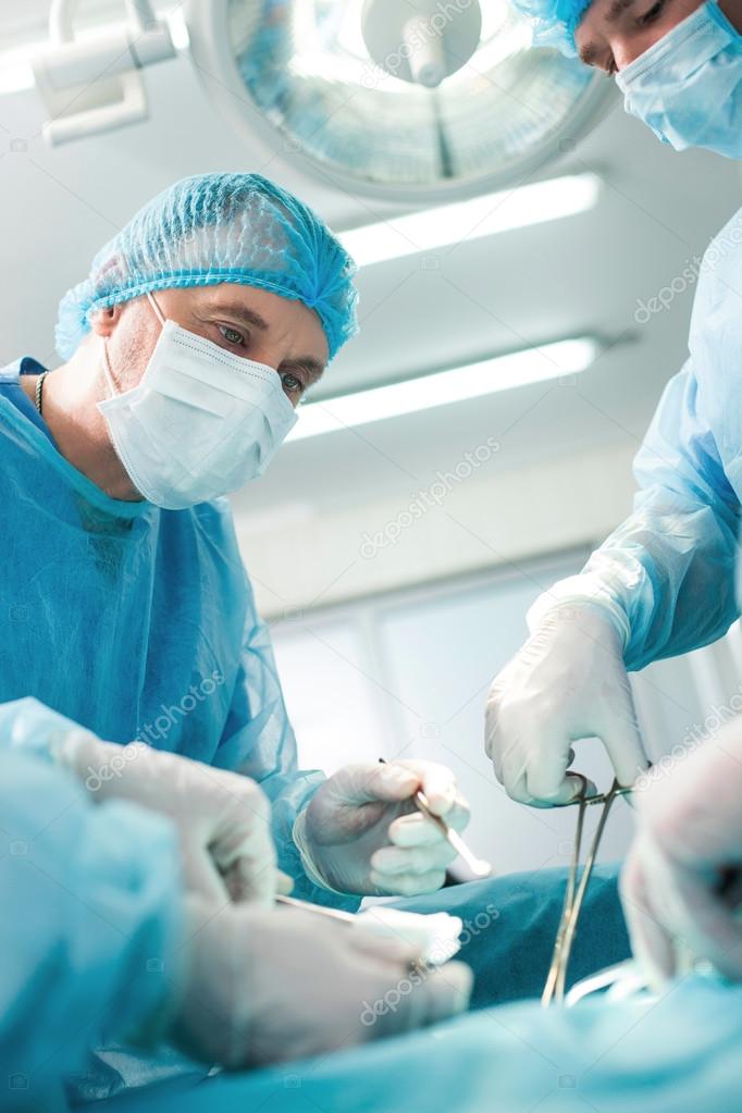 Professional surgical team is doing an operation