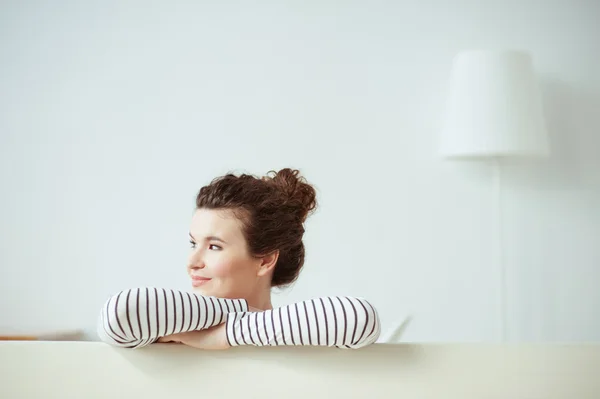 Beautiful young woman is relaxing at home — Stock Photo, Image