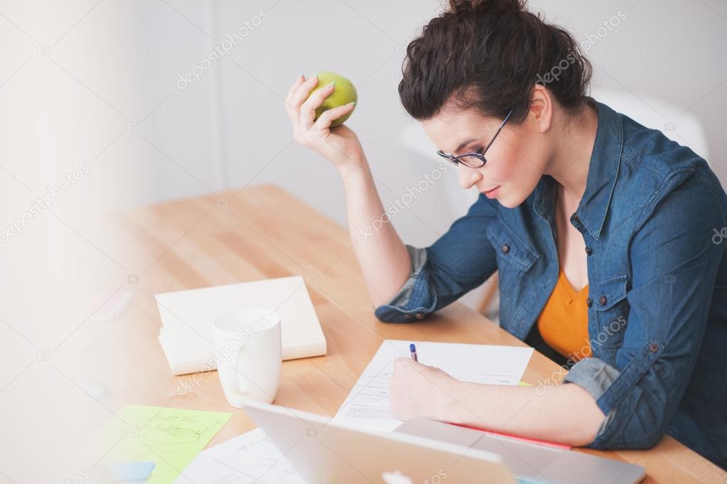 Attractive female worker is very busy