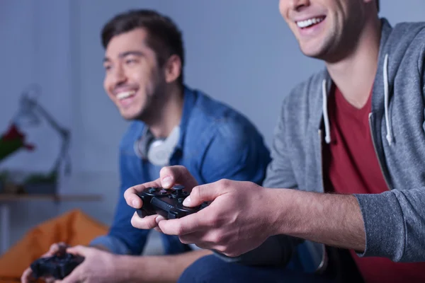 Cute young guys are resting with video play — Stock Photo, Image