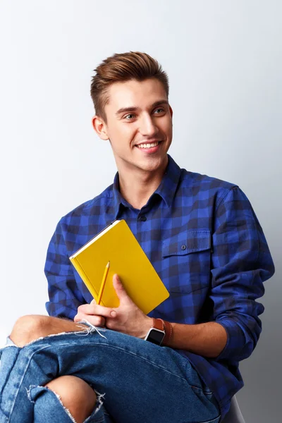 Handsome male student is preparing for studying — Stock Photo, Image