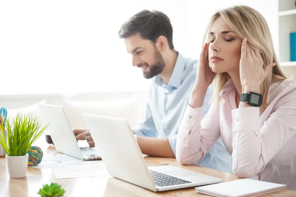 Pretty businesswoman has a terrible headache — Stock Photo, Image