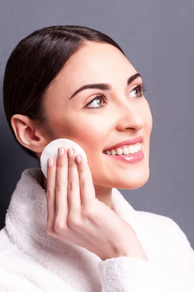 Cheerful young woman is resting in bathrobe — Stock Photo, Image