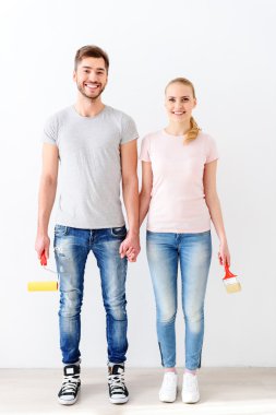 Young couple ready to start repair