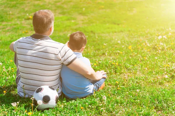 Pretty child is resting with his grandfather — Stock Photo, Image